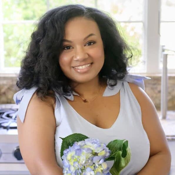 Eden Westbrook at a copper sink prepping cut hydrangeas